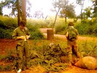 Picking out "Clean Fatigues" Eugen Lewis (L) and Robert Paquin picking out "clean fatigues". Quan Loi Base Camp JGiffin Photo